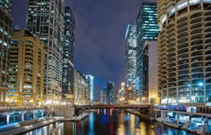 Chicago river at night with boats and lights on near Hotel Chicago Downtown, Autograph Collection