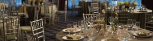 Reception set up with glassware and silver chairs