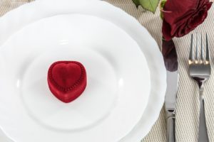 Heart shaped ring box on a plate